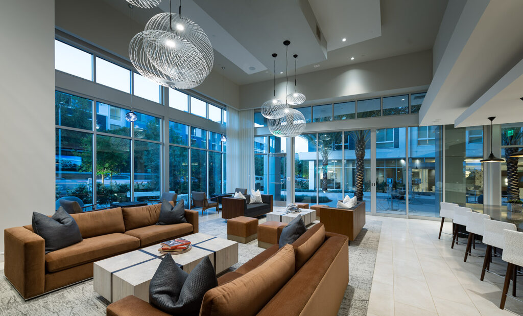Clubhouse with modern plush furniture, designer lighting and bar seating