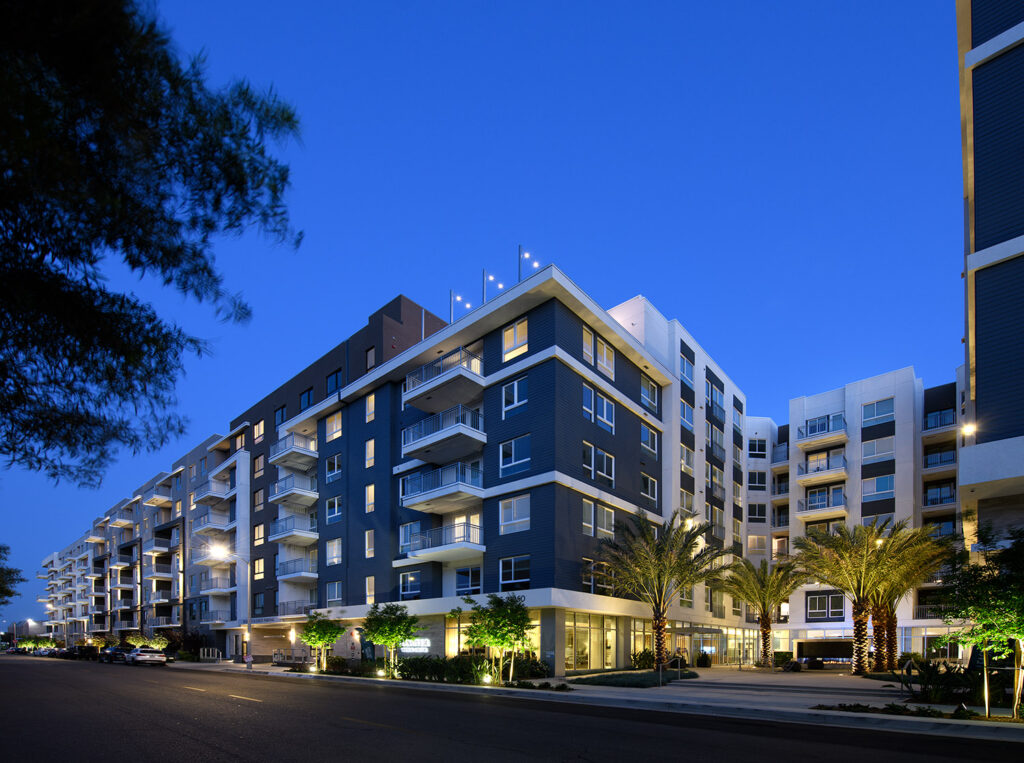 Community exterior with lights at dusk