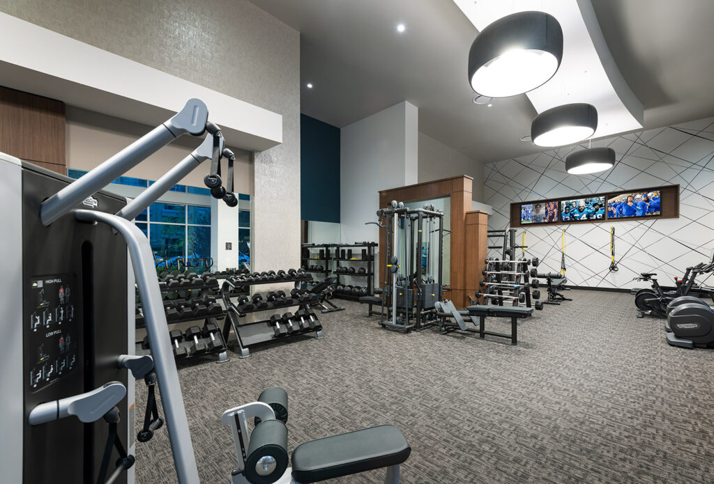 Fitness center with strength training equipment and free weights