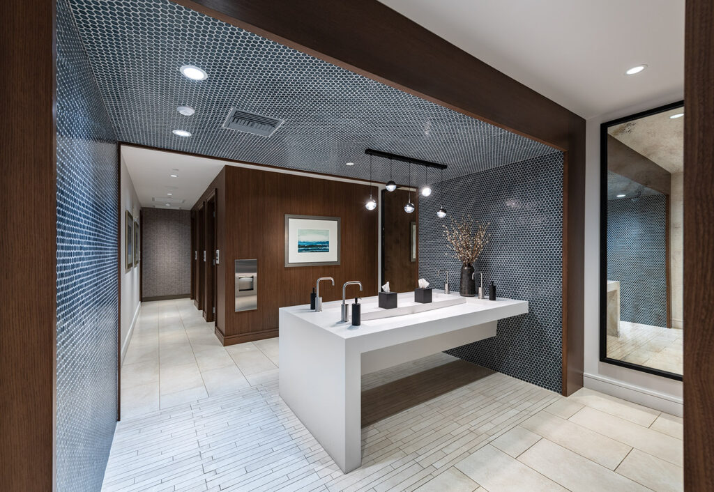 Clubhouse restroom with designer tiles and modern sinks
