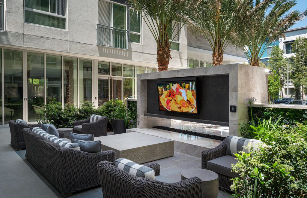 Firepit area with a large outdoor flat screen TV