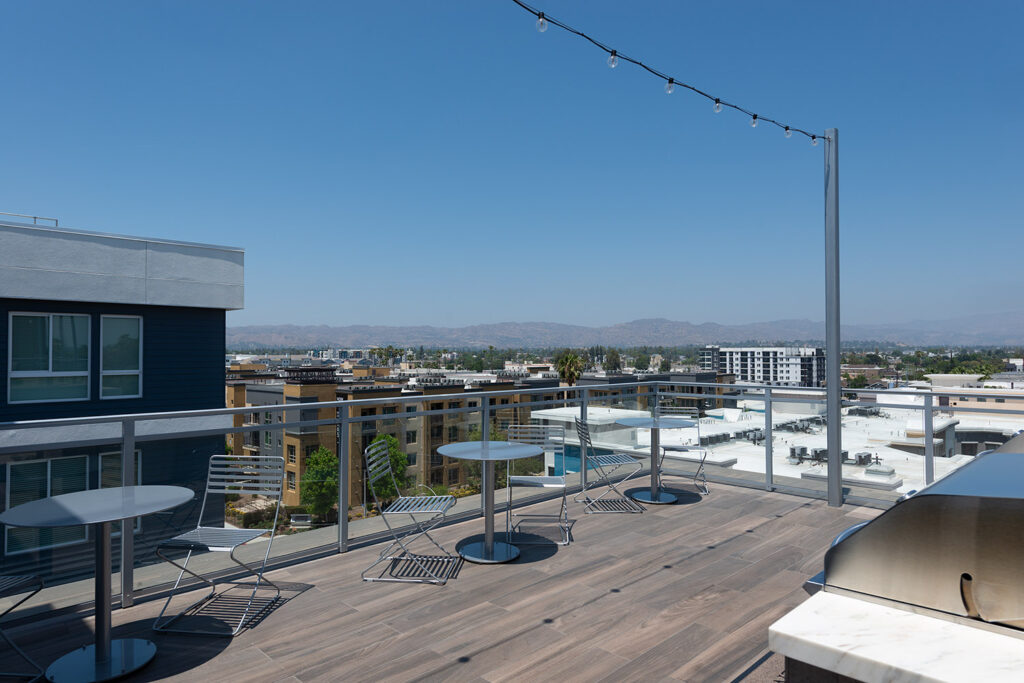 Rooftop deck with patio seating and a BBQ Grill