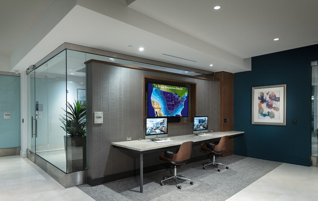 Clubhouse computer lounge with dual iMac computers and desk chairs